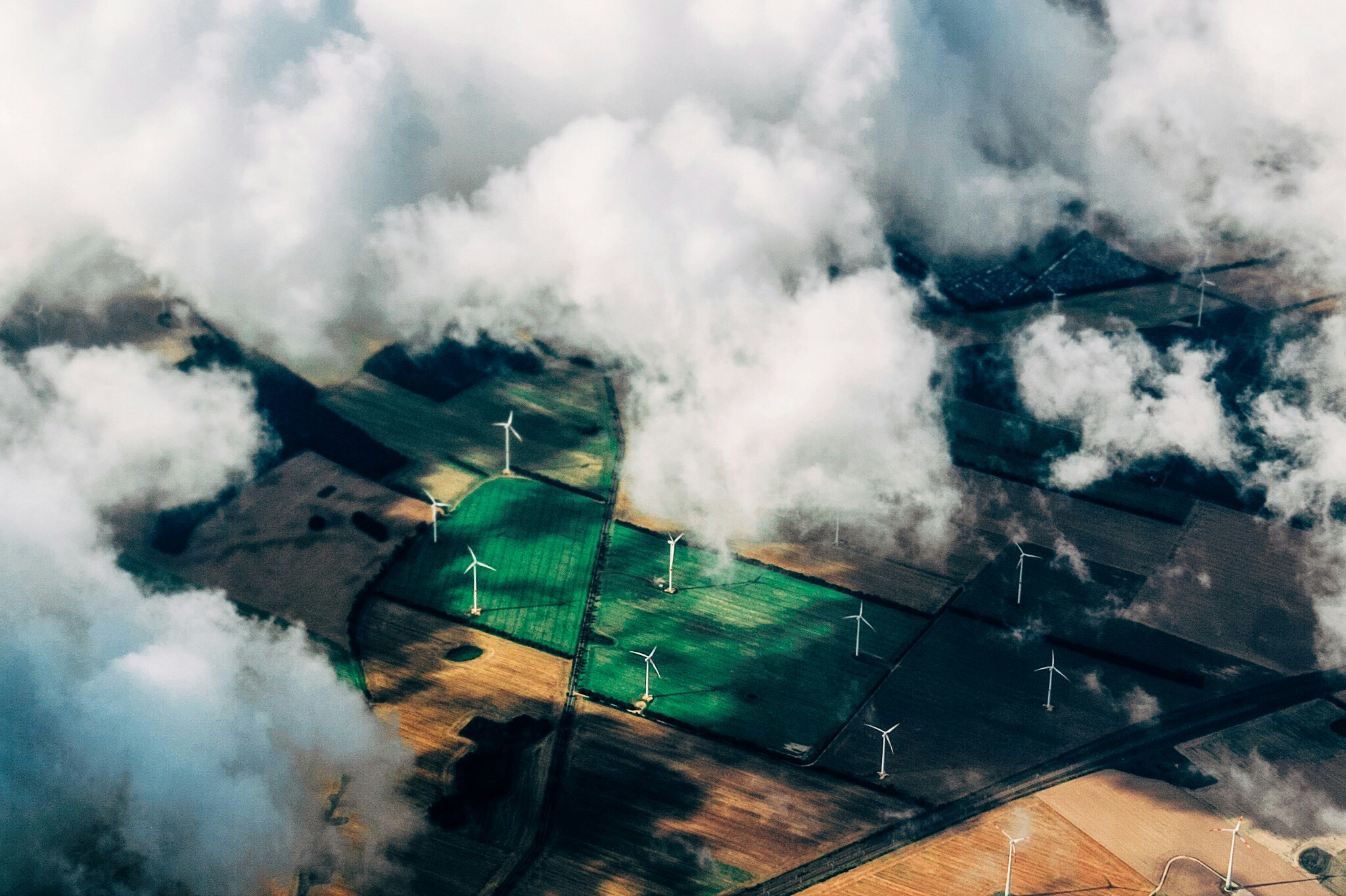 Windmills in field aerial view Website Header 